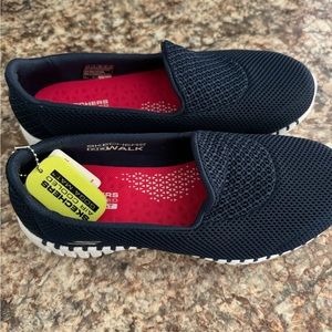 Women’s size 6 NWT Skechers go walk slide on shoes. Navy, goga mat insole.